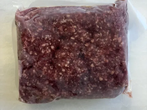 Ground Beef (1-lb packs), vacuum-sealed pack.